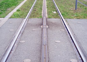A section of APS track showing the neutral sections at the end of the powered segments plus one of the insulating joint boxes (from Wikipedia)